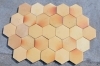 Hexagonal floor tiles with a shaded yellow discoloration